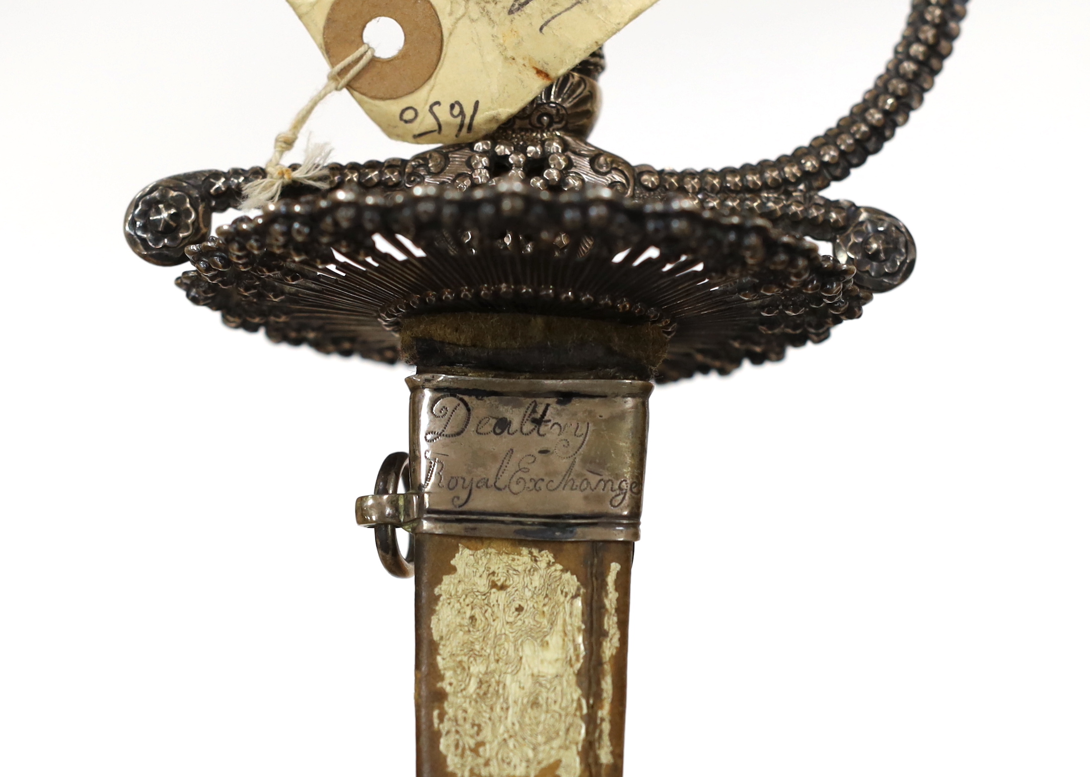 An English small sword, c.1775, pierced with facetted stud work, silver tape and wire bound grip, triangular section etched blade, in its original vellum scabbard and silver mounts, top mount engraved Dieltry Royal Excha